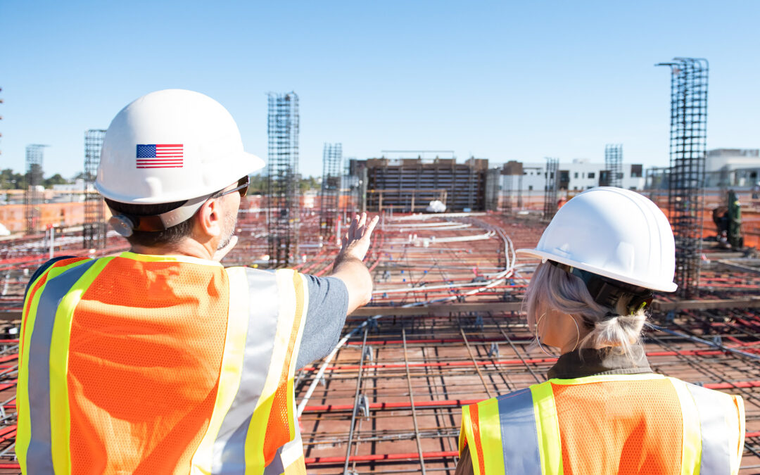 Construction workers looking over the job site