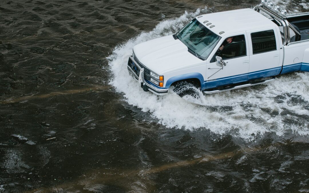 Truck driving through flood waters