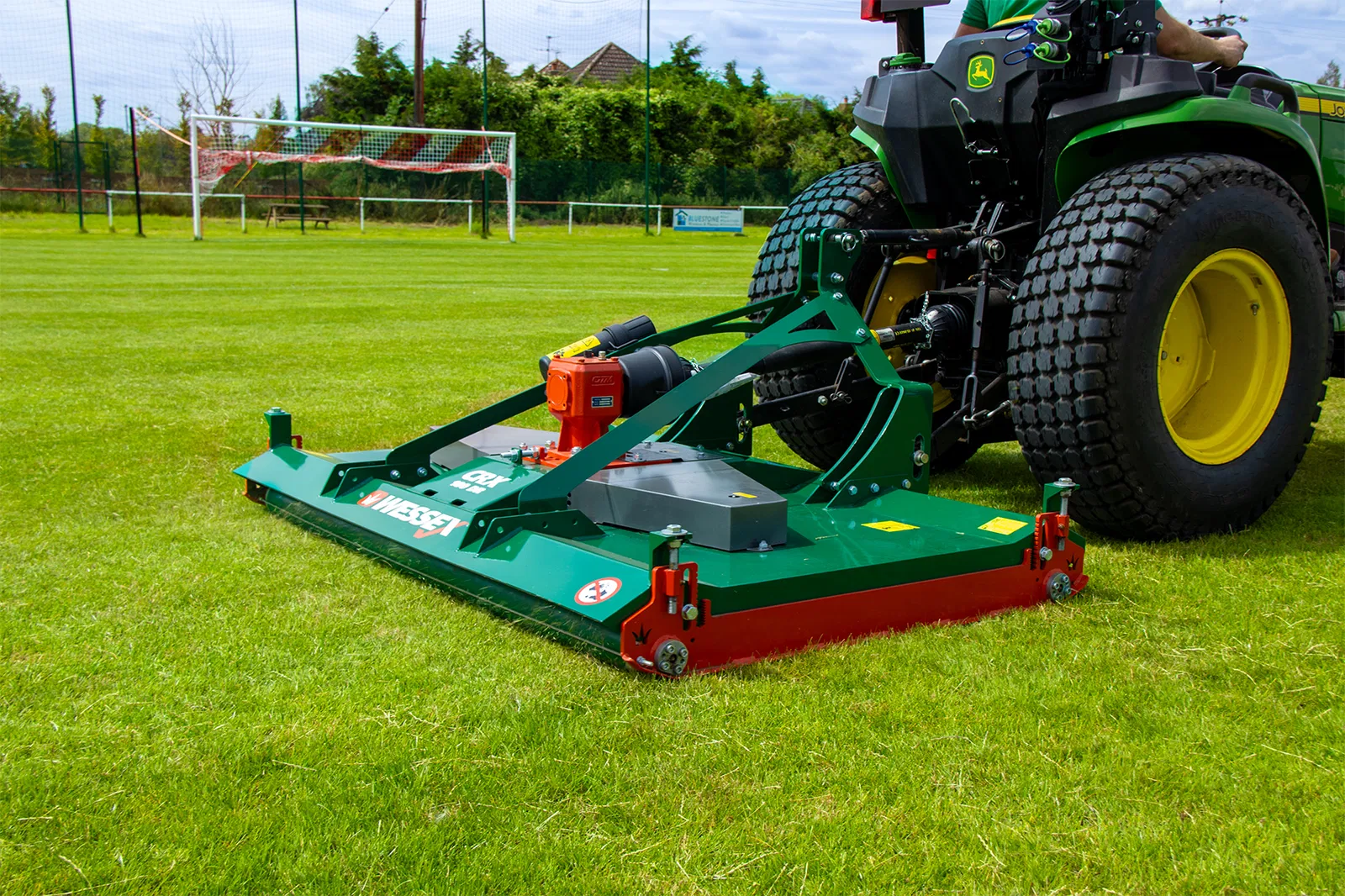 Wessex CRX-DR-12 Rotary Mower being pulled by a John Deere Tractor.