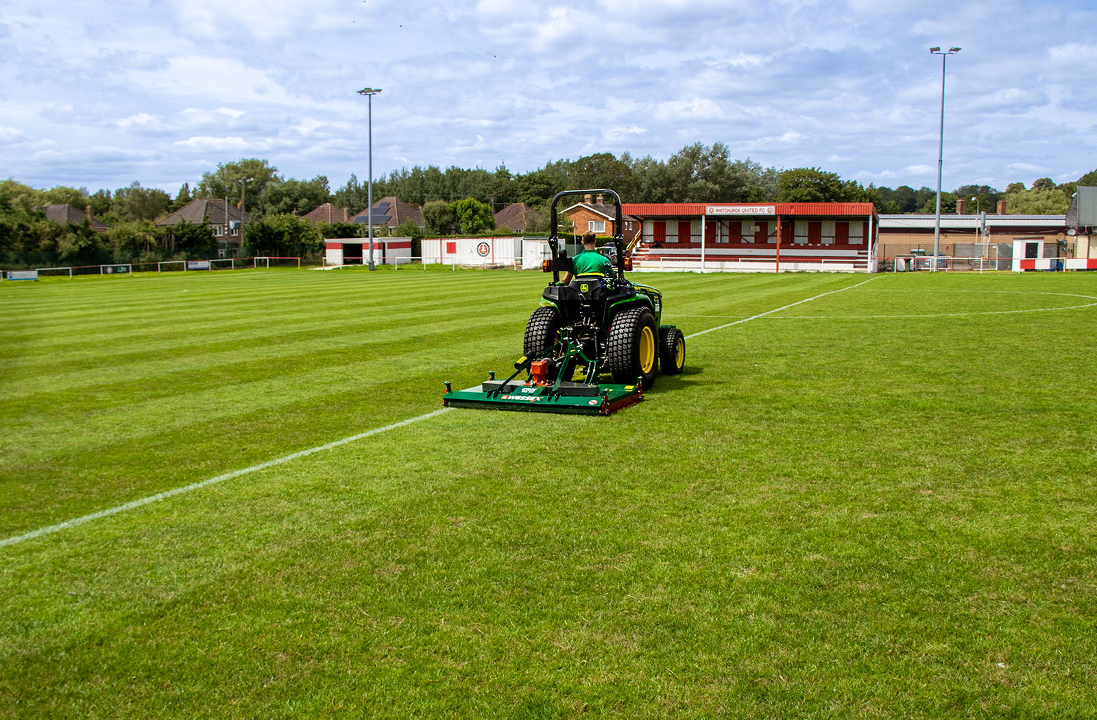 Wessex CRX-DR-12 Rotary Mower being pulled by a John Deere Tractor.