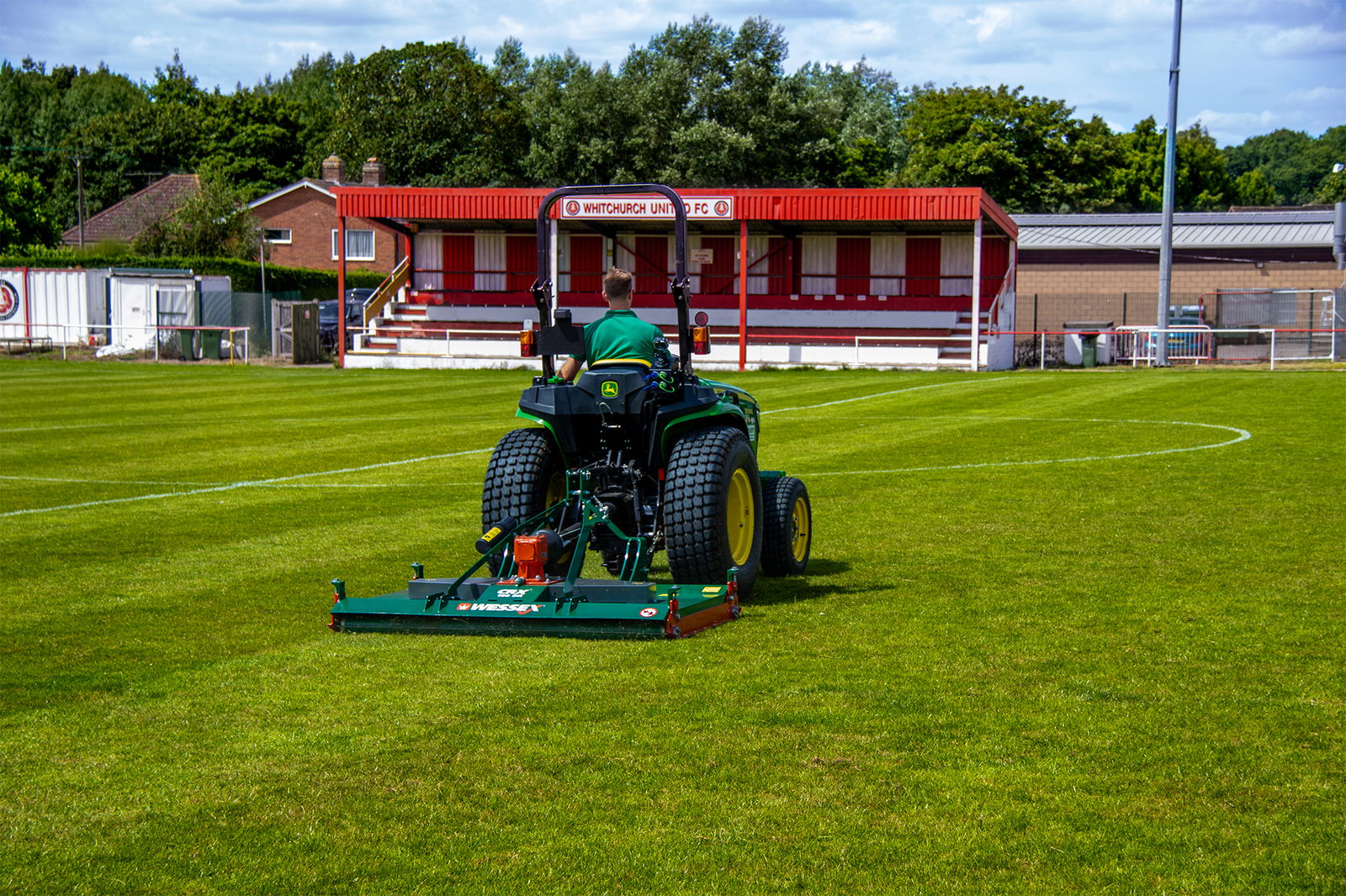 Wessex CRX-DR-12 Rotary Mower being pulled by a John Deere Tractor.