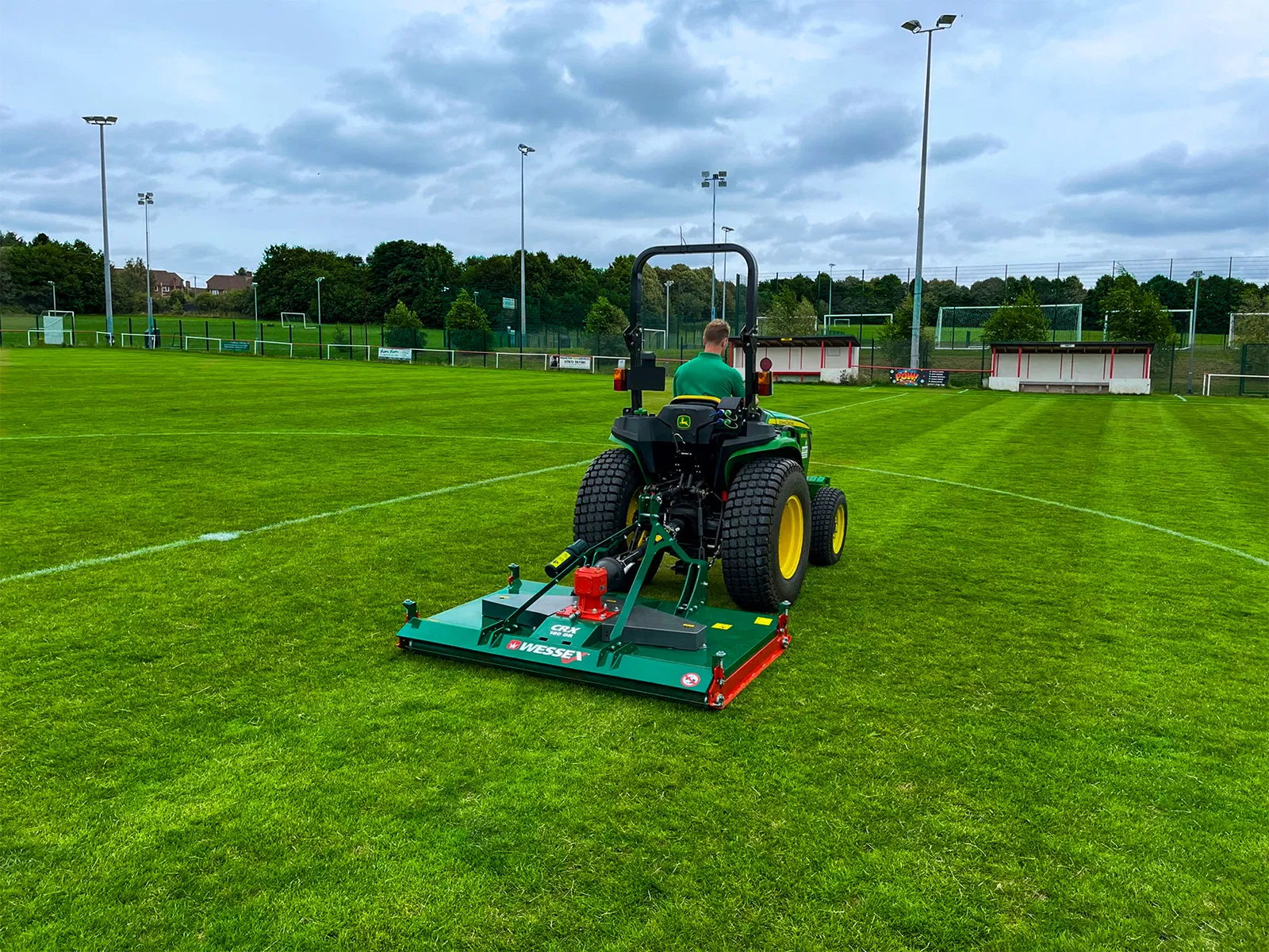Wessex CRX-DR-12 Rotary Mower being pulled by a John Deere Tractor.